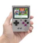 NEW Bittboy V3 Retro Gaming Handheld Emulator - Front View playing Pokemon