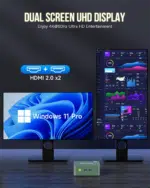 GMKtec mini PC connected to dual HD displays, showcasing its capability to support multiple screens simultaneously. The setup includes a sleek, compact black mini PC unit with HDMI ports used to connect two high-definition monitors displaying vibrant, crisp visuals.