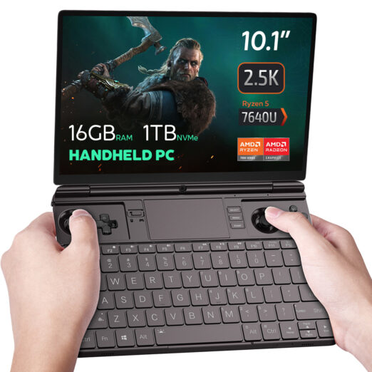 This image shows a GPD Win Max 2 2023, a handheld gaming PC. The screen highlights its key specifications, including a 10.1-inch display with a 2.5K resolution, 16GB of RAM, and 1TB of NVMe storage. It is powered by an AMD Ryzen 5 7640U processor from the Ryzen 7000 series and includes AMD Radeon graphics. The device has built-in gaming controls with joysticks, buttons, and a D-pad, along with a physical QWERTY keyboard for typing. The design suggests it’s tailored for both gaming and productivity, making it a versatile compact device.