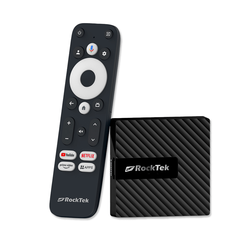 RockTek GB1 Android TV box shown alongside its dedicated remote control. The compact device has a sleek, textured design. The remote features a circular navigation pad, voice control button, and dedicated buttons for popular streaming services like YouTube, Netflix, and Prime Video, along with an 'Apps' button for quick access to installed applications