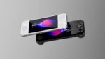 Two AYANEO Pocket S2 handheld gaming consoles one white and one black are shown floating or angled against a plain grey background The white console is on top slightly to the left displaying AYANEO Pocket S2 on its screen with a colorful abstract background The black console is beneath it angled similarly with its screen also showing AYANEO Pocket S2 but partially obscured