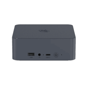A straight on front view of a dark grey square shaped mini PC with rounded corners set against a solid dark green background The top surface has a subtle textured pattern and a circular logo The front panel features a USB A port a headphone jack a USB C port and a power button with a circular LED indicator All ports and buttons are labeled with white text