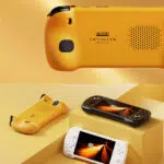 A split view promotional image of the KONKR Pocket Fit The top half is a close up shot of the back of the yellow console highlighting the KONKR logo and speaker grille The bottom half shows the yellow console lying on its back on a geometric yellow and orange platform while the black and white consoles are angled to show their screens and front controls